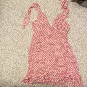 Short pink and white patterned mini dress with tie straps